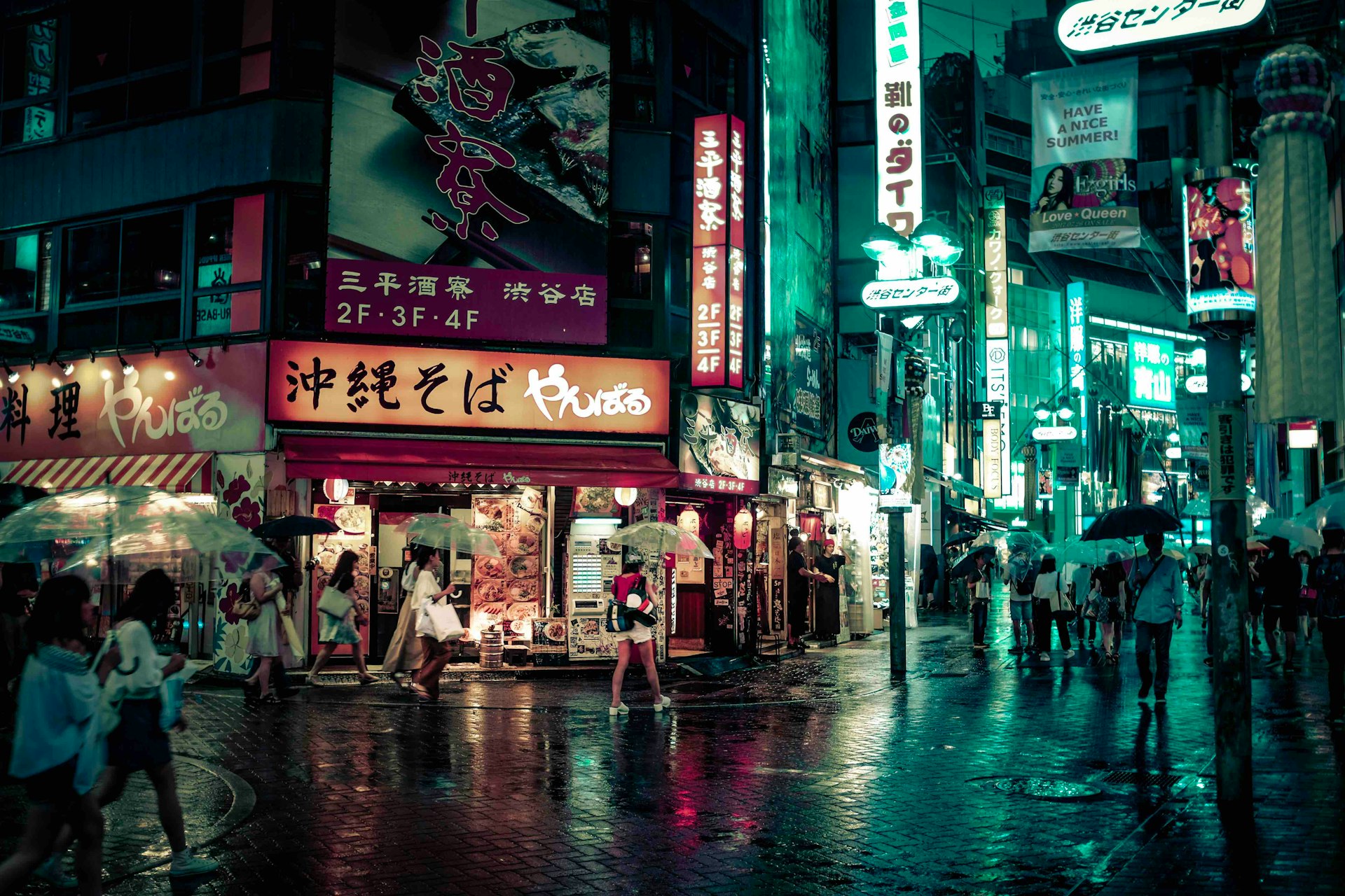 people walking near buildings at night